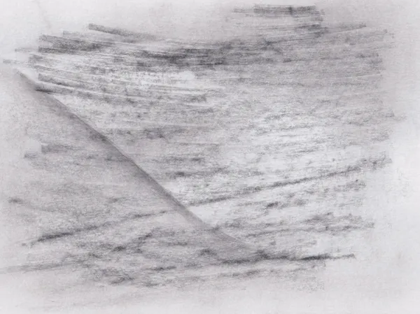 Soft graphite strokes running across white paper, cut by a single diagonal crease of tone