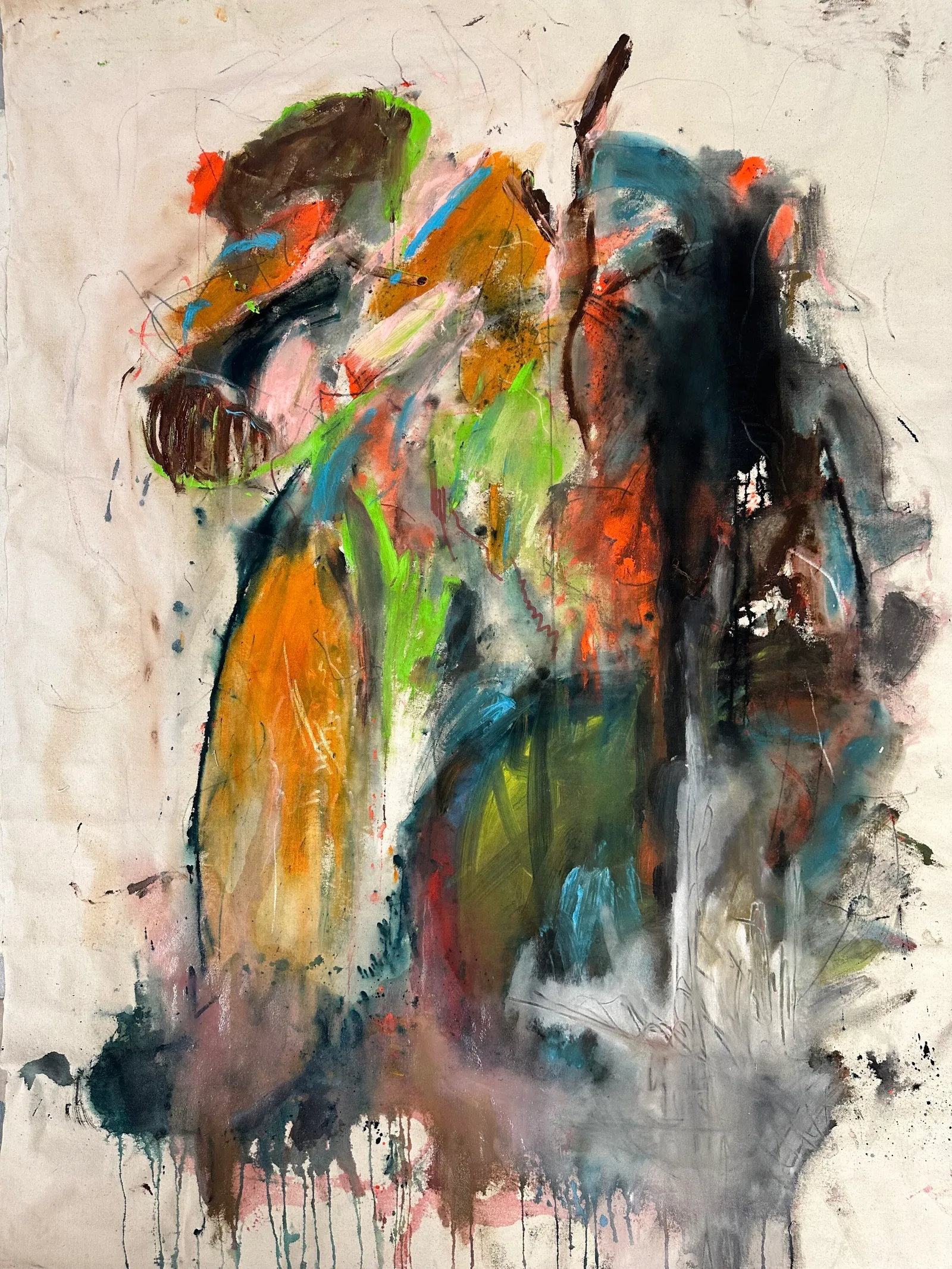 Unstretched canvas with a dark upright form of orange, green, black and grey running down into drips